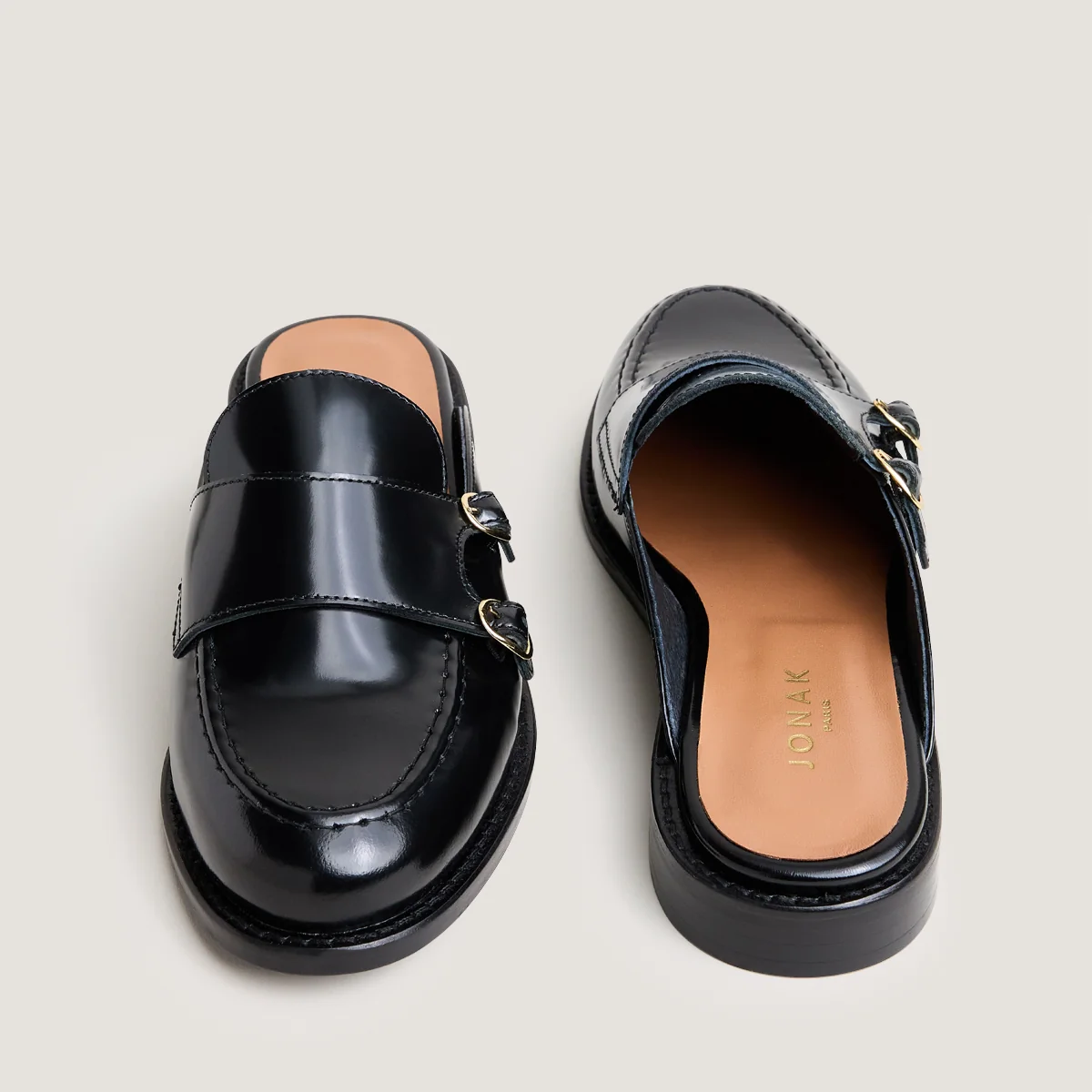 Jonak | Distant Mules in Glazed Black Leather with Metal Rings